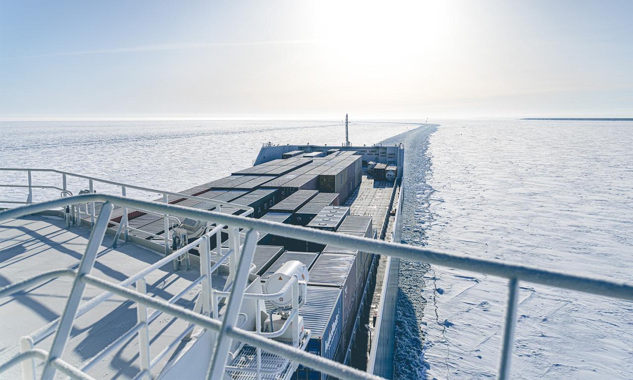 A frosty container deck on a ship on an ice-covered sea